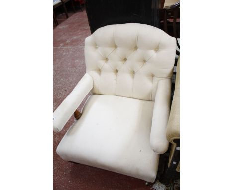 A Victorian button back upholstered armchair