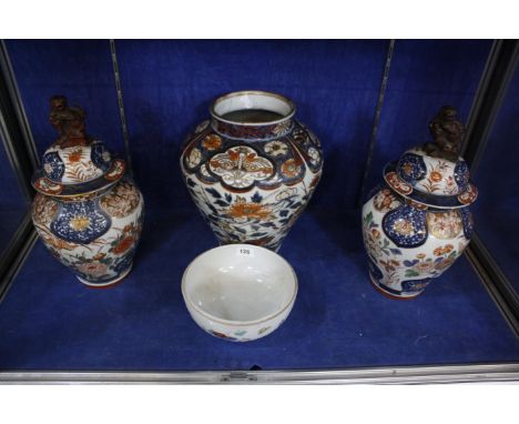 A pair of Japanese export Imari vases with covers and a larger example (lacking cover) and a modern Chinese porcelain bowl (l