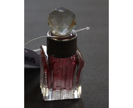 An Edwardian ruby and clear glass scent bottle and stopper, with silver mounted rim, Birmingham 1903, 5cm high Best Bid