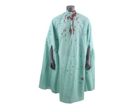 DUMB AND DUMBER (1994) - Lloyd Christmas' (Jim Carrey) Bloodied Barber Cape - Lloyd Christmas' (Jim Carrey) barber cape from 