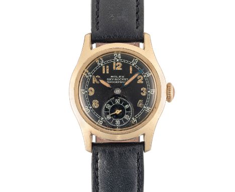 A GENTLEMAN'S SIZE GOLD CAPPED ROLEX SKY ROCKET WRIST WATCHCIRCA 1940, FOR THE CANADIAN MARKET, BLACK 24 HOUR DIAL WITH LUMIN