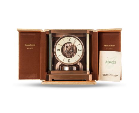 A RARE PINK NICKEL PLATED JAEGER LECOULTRE ATMOS DESK CLOCK CIRCA 1960, RETAILED BY DUCOMMUN'S OF JOHANNESBURG, ACCOMPANIED B