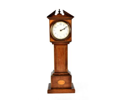 An early 20th century mahogany inlaid mantel clock in the form of a longcase clock, the dial set with Arabic numerals, height