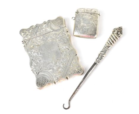 A Victorian hallmarked silver card case with Classical decoration by Arthur Fenwick, Birmingham 1899, a hallmarked silver ves