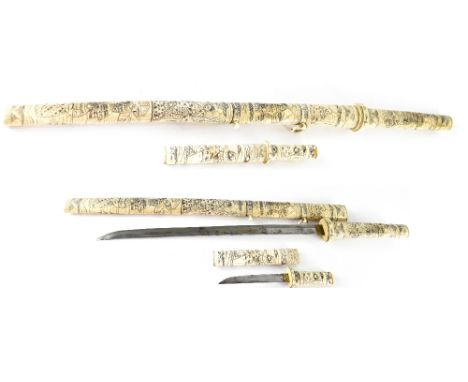 A 19th century Japanese sword, length of blade 43cm, hilt and scabbard completely covered in bone and carved with figures and