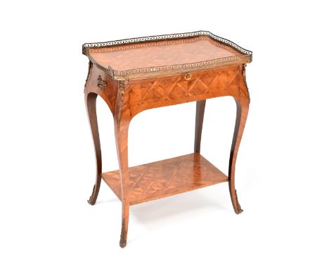 A late 19th/early 20th century mahogany side table with single frieze drawer, brush-in slide, parquetry top and pierced brass