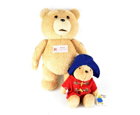 An R-rated 'Talking Ted' Teddy bear quoting various rude phrases from the film, height 60cm and a further Paddington plush to