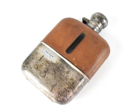 A George VI leather-bound hip flask with removable hallmarked silver cup and lid, F Burton Crosbee, Birmingham 1949, height 1