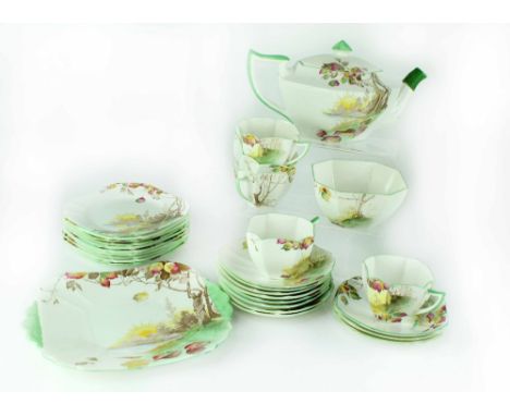 A Shelley Queen Anne shape 'Autumn Leaves' part tea service to include teapot, sandwich plate, five cups, sugar bowl, saucers