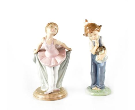 Two Nao figures, a young ballerina in pink tutu and a young girl in dungarees (2).