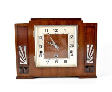 An Art Deco mahogany-cased chiming mantel clock, the silvered square chapter ring set with Arabic numerals, width 29cm, heigh