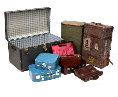 A vintage metal-bound travelling trunk, a leather suitcase, five further suitcases and a leather satchel (8).