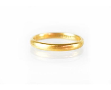 A 22ct yellow gold wedding band, size N1/2, approx 3.4g. CONDITION REPORT No obvious signs of damage. Some light scratches, h