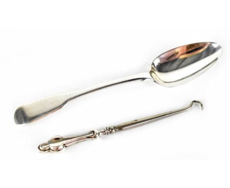 A hallmarked silver fiddle pattern teaspoon, length 18cm and a silver-handled button hook, marks rubbed combined approx 2ozt 