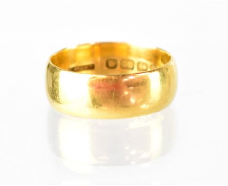 A 22ct wide band ring, size Q/R, width 7mm, approx 9.2g.