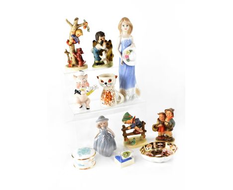 A small collection of ceramics to include four Hummel figures, a Walt Disney figure of one of the Three Little Pigs playing a