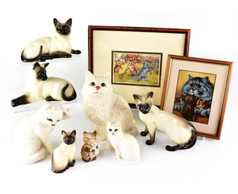 A Louis Wain framed postcard and a print and Beswick porcelain cats including four Siamese, three white glaze and a smaller c