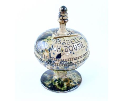A 19th century Staffordshire Whieldon-type pottery money box, presented in the form of a pedestal bowl and cover with turned 