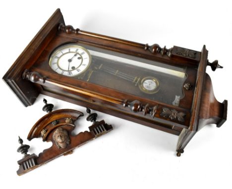 A reproduction stained beech Vienna wall clock with spring-driven movement, height approx 95cm.  CONDITION REPORT Several of 
