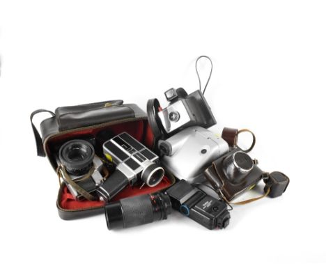 A quantity of various cameras and accessories to include a Petri camera with a Carperu MXV lens and leather case, a Polaroid 