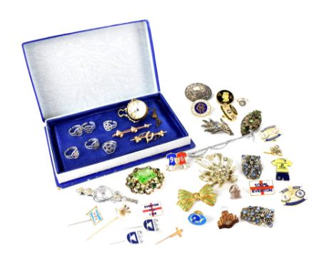 A small mixed lot of costume jewellery to include a 15ct gold and seed pearl brooch, six white metal rings stamped 925, a hal