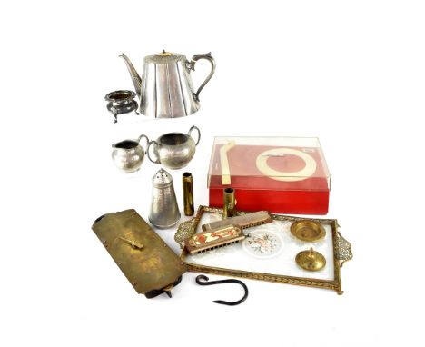 A vintage Stella record player together with various items of metalware including brass scales, trench art and two harmonicas