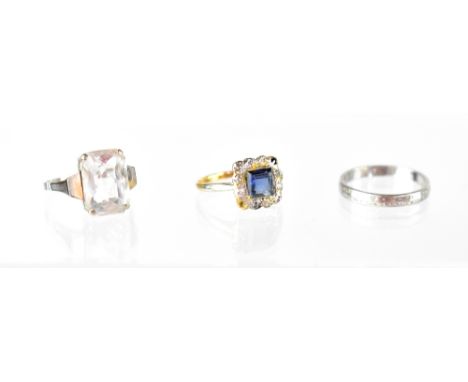 Three fashion rings including a platinum band ring, size K/L, approx 2.4g, a 9ct white gold and white stone ring, size K and 