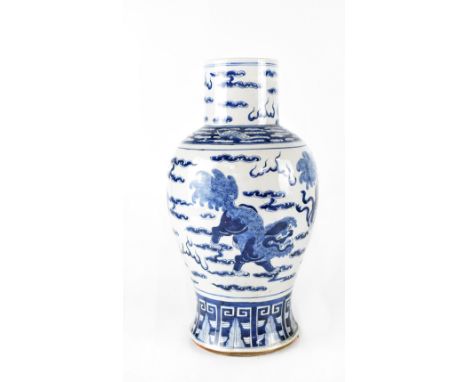 A large Chinese blue and white baluster vase painted with chichi amongst clouds and lotus leaf lower border, unmarked, height