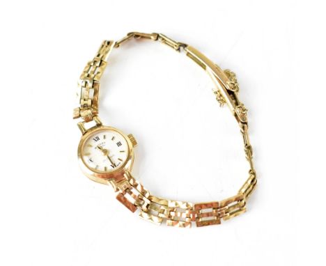 A ladies' vintage Rotary wristwatch on a 9ct gold textured and pierced strap, approx 11.5g. CONDITION REPORT Not in going ord