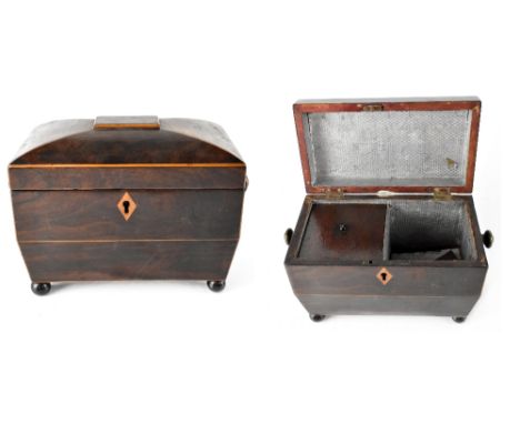 A 19th century sarcophagus tea caddy, carrying handles to either side, on small bun supports, 15 x 21cm.