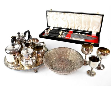 A quantity of electroplated items to include tea sets, goblets, ladles and a large quantity of silver-plated and other flatwa