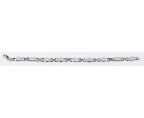 An opal bracelet and matching pendant, the bracelet is set with nine oval opal cabochons, marked 14k, length 17.0cm, the brac