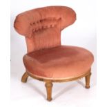 An Edwardian oak, beech and pink fabric