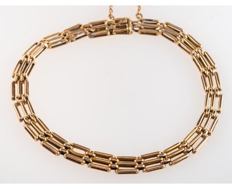 A gate bracelet, with push-in clasp and safety chain, marked 15, length approx. 19.0cm, 8.9grams.