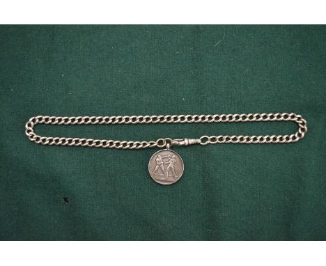 A silver boxing pendant and chain.