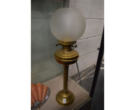 A brass oil lamp.