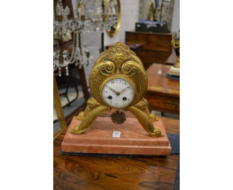 Decorative gilt brass and marble mantel clock.