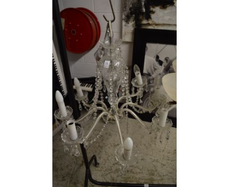 A cut glass eight branch chandelier.