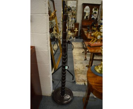 A bobbin turned standard lamp.