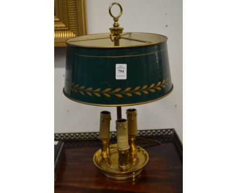 A good gilt brass three light table lamp with toleware shade.