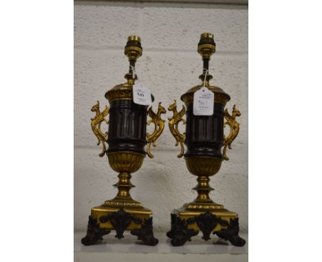 A pair of ormolu and bronze classical style urn shaped lamp bases.