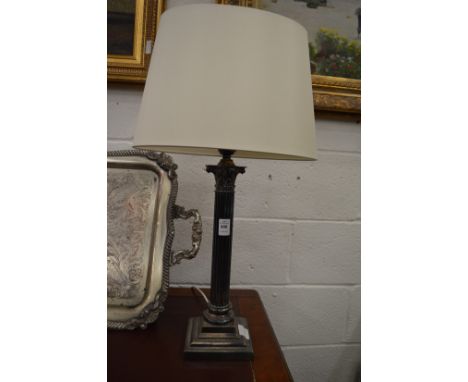 A plated corinthian column style table lamp.