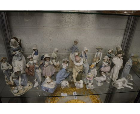 A good collection of Lladro, Nao and other figures.