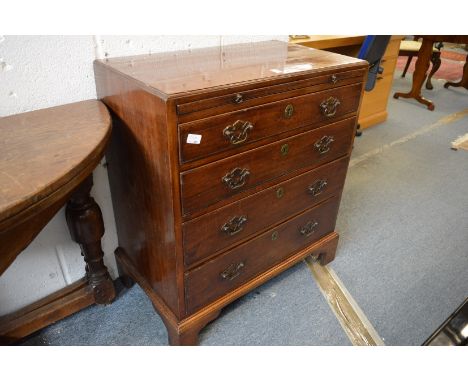 A George III mahogany caddy top chest of drawers with brushing slide, four graduated long drawers on bracket feet.