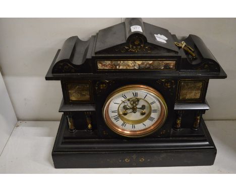 A Victorian slate mantel clock.