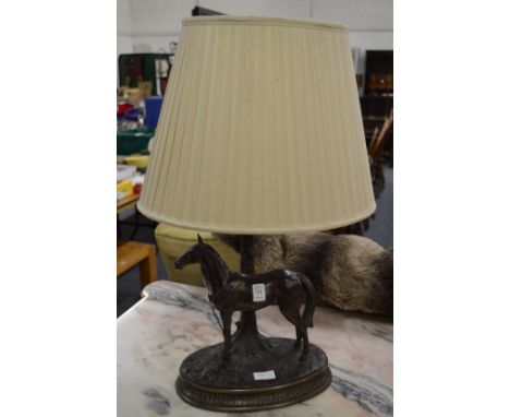Bronze resin table lamp modelled as a horse standing beneath a tree.
