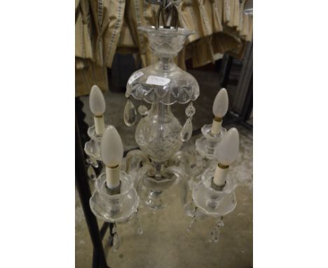 A cut glass five branch chandelier.