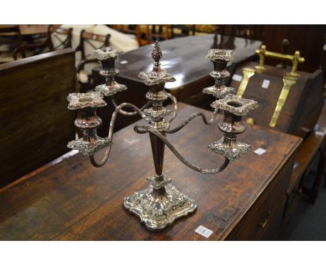 A silver plated four branch five light candelabra.