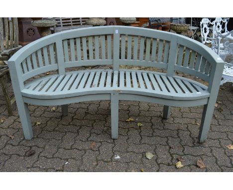 A pale green painted garden bench.