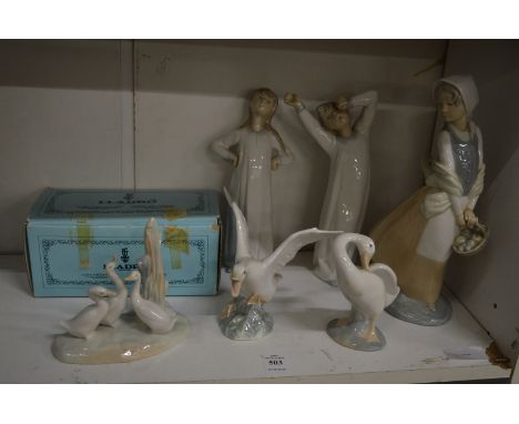Lladro and Nao porcelain figures.